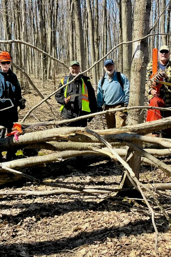 Beaver Valley Bruce Trail chainsaw crew is all smiles during while working to clear trail after the damaging ice storm