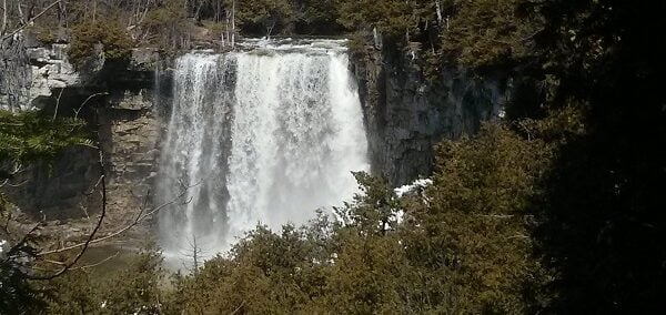 Water rushes over the falls Eugenia Falls with the full force of spring flows