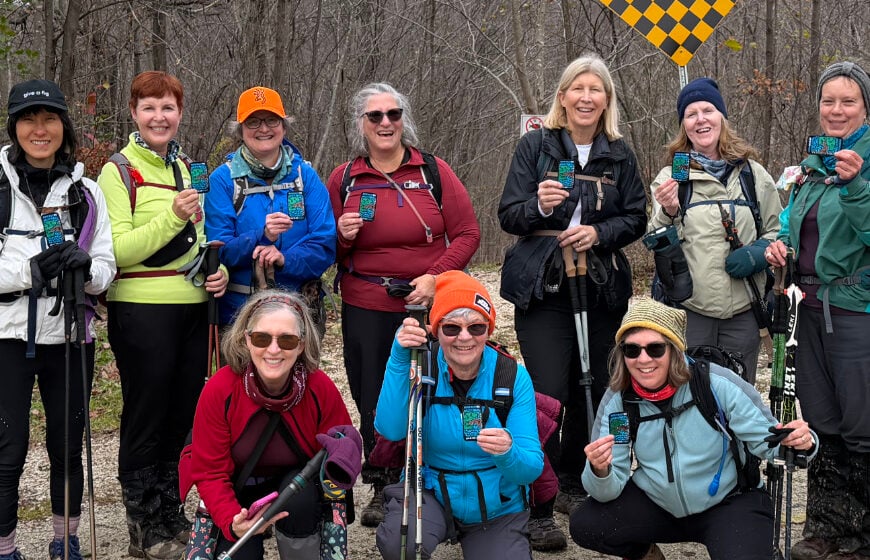 Cropped-close-up-ladies-holding-newly-earned-E2E-in-8-badges